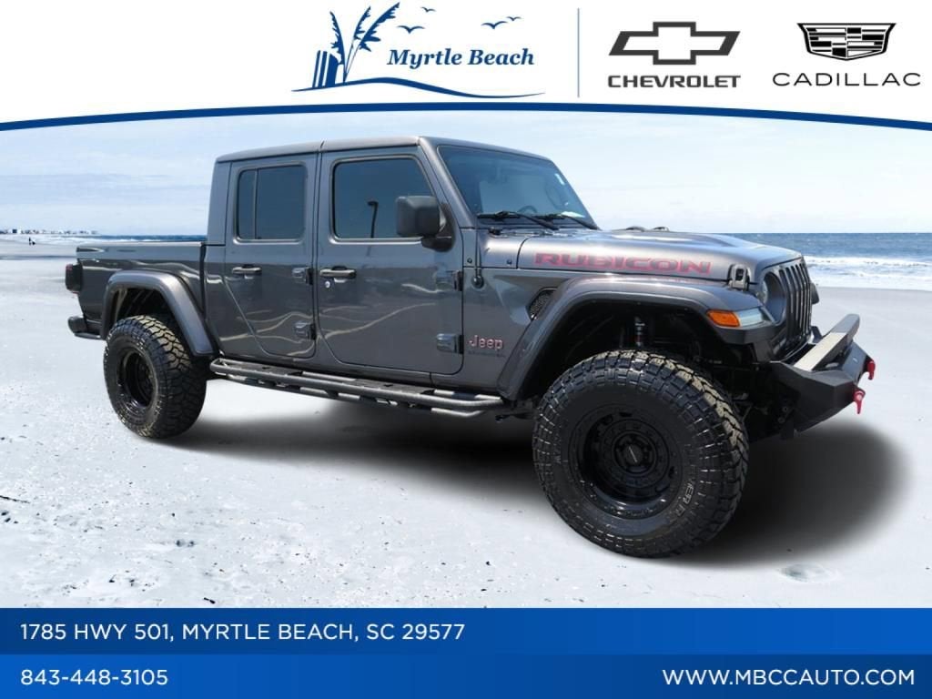 2020 Jeep Gladiator Rubicon in Sting-Gray Clearcoat — front three-quarter view