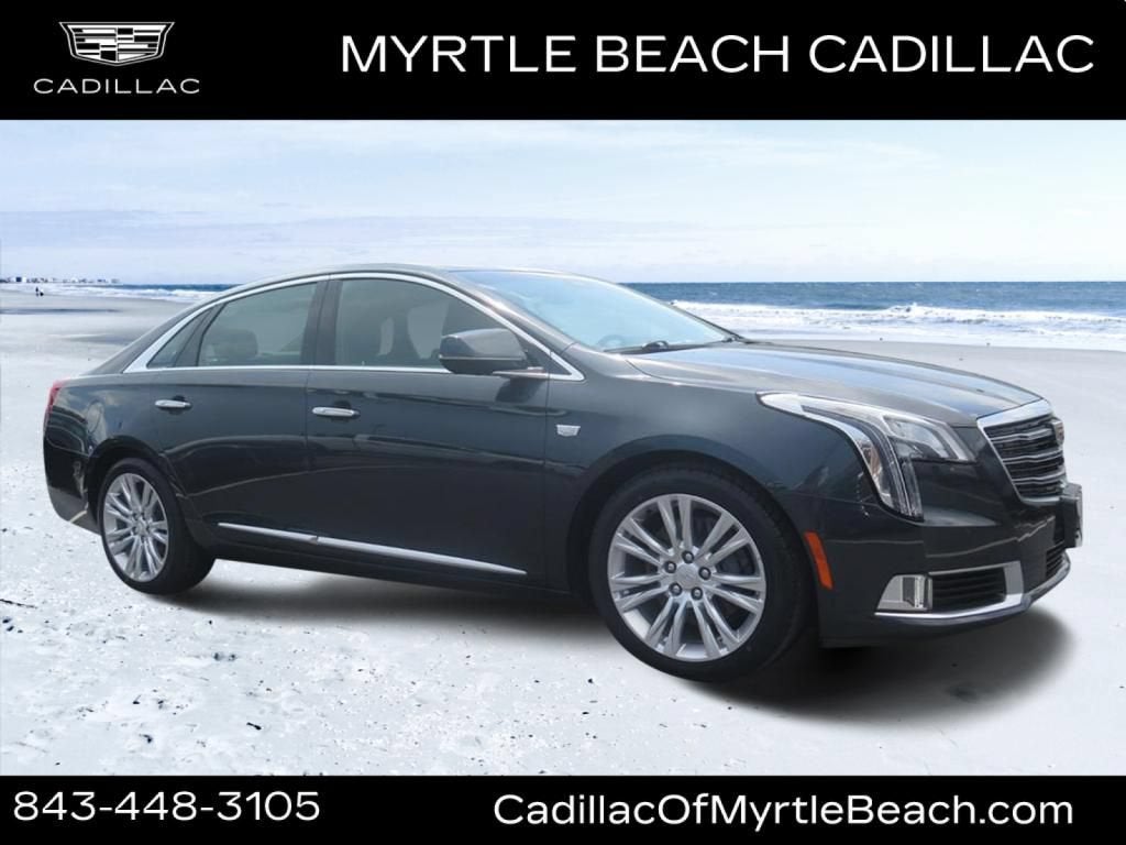 2019 Cadillac XTS Luxury in Stone Gray Metallic — front three-quarter view